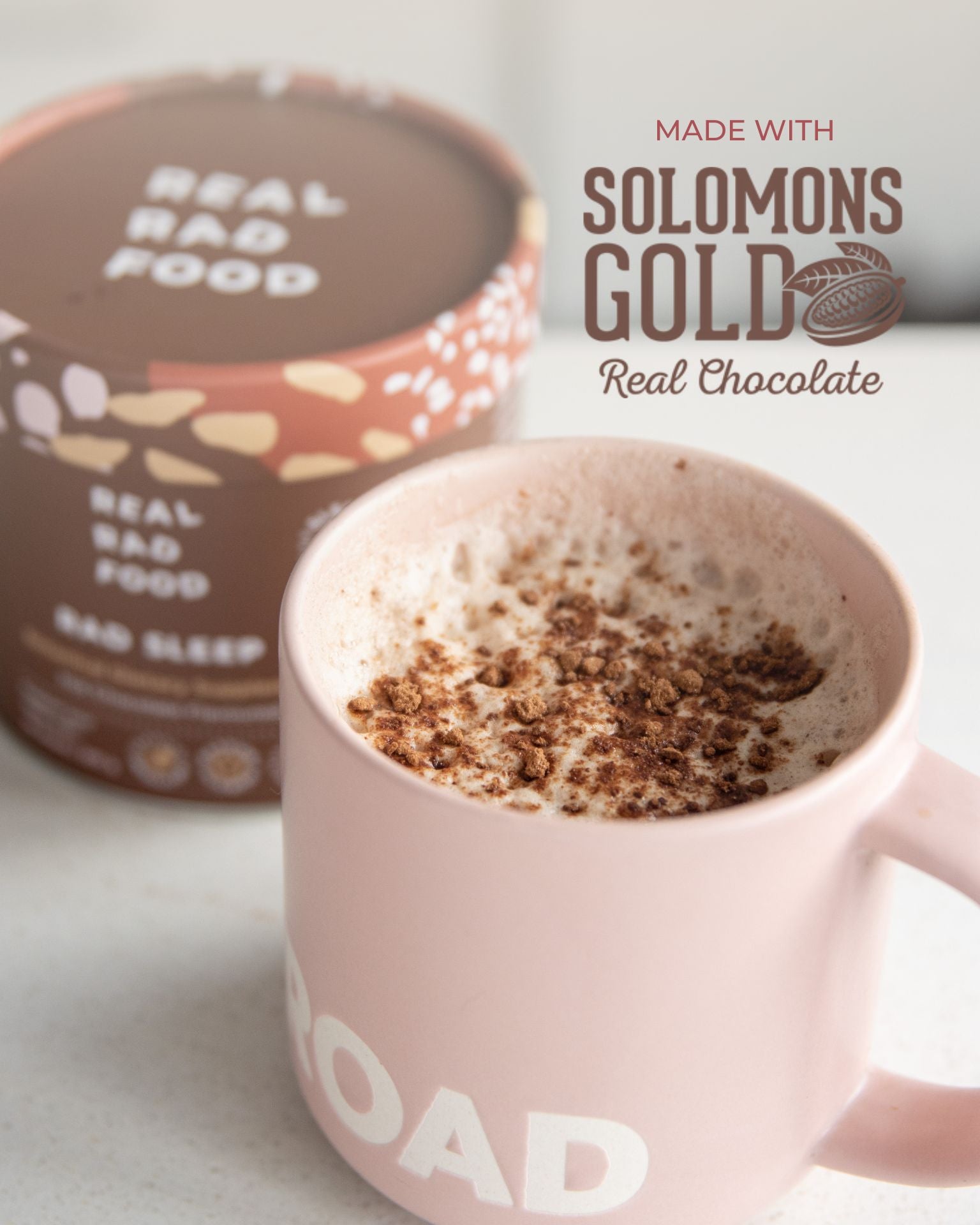 Mug of Real Rad Food Rad Sleep sleepy hot chocolate made with Solomon’s Gold real chocolate beside a Rad Sleep botanical supplement tin